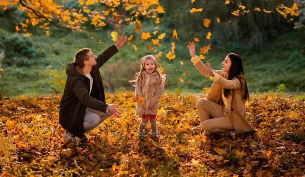 family at a family photoshoot, playing with the seasons and having fun