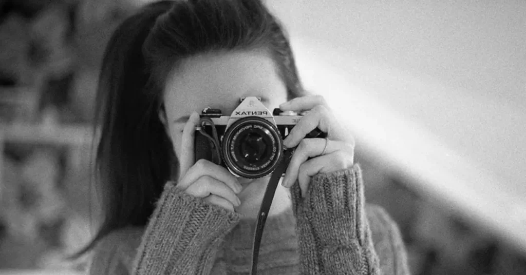 woman photographer shooting a photo for boudoir photography for men