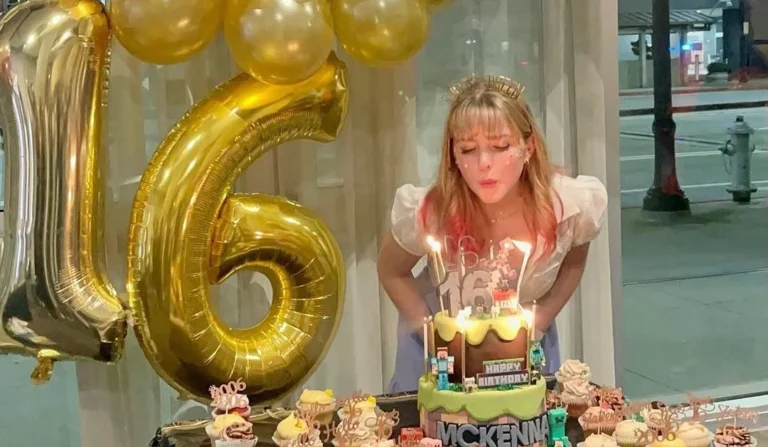 girl on her 16th birthday photoshoot blowing her candles next to 16th birthday ballons