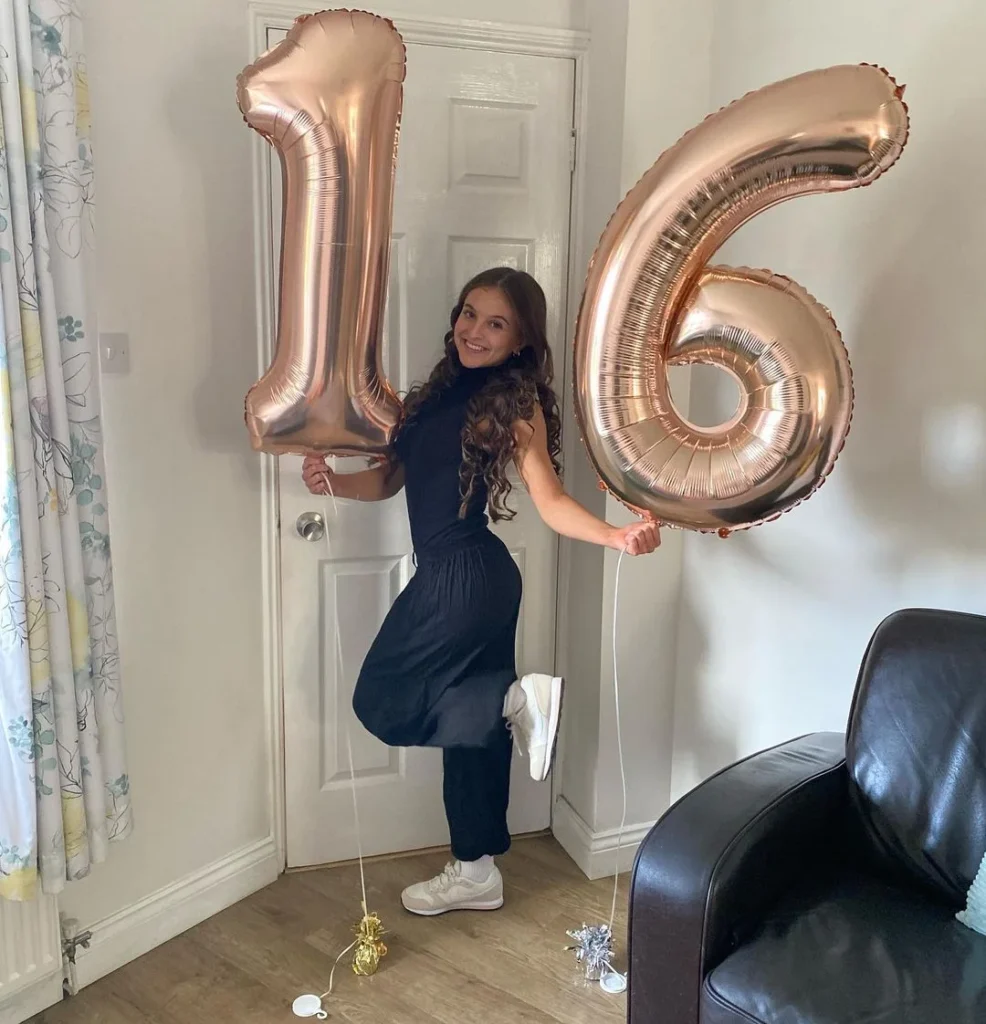 16th birthday photo with ballons and happy posing