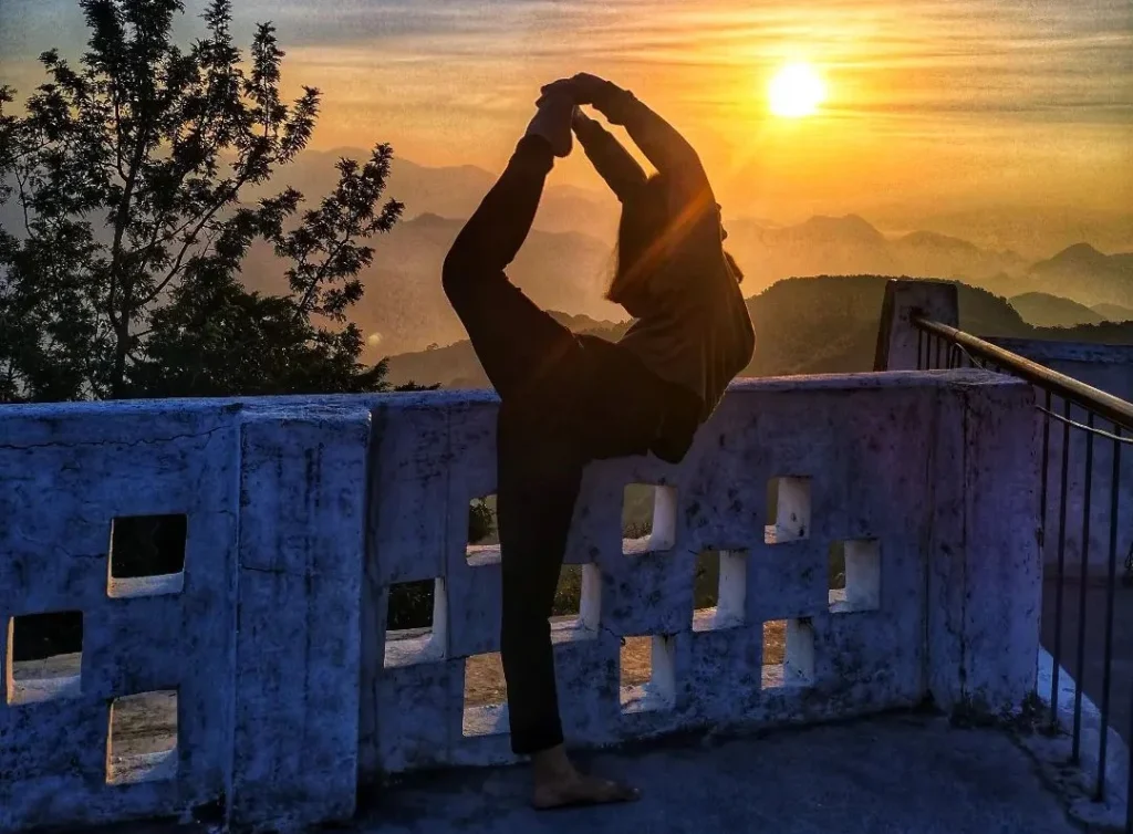 beautiful image of a girl doing yoga outside in the sunset during the golden hour, creating a really cute and dynamic photo pose