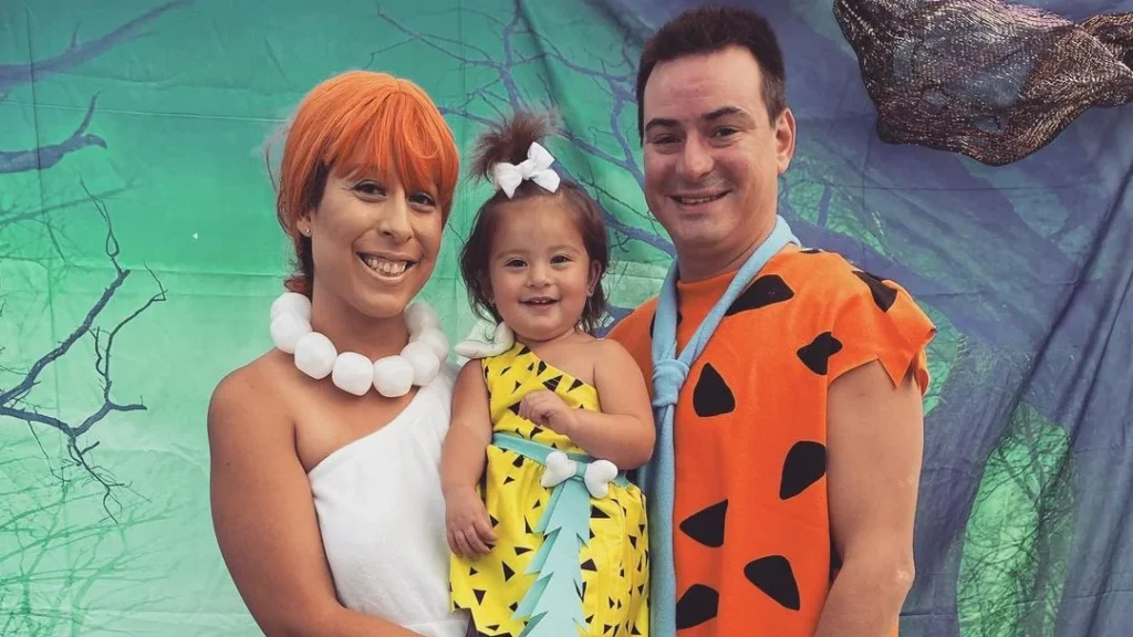 family dressed up as the flintstones to have a cute halloween photoshoot as a family