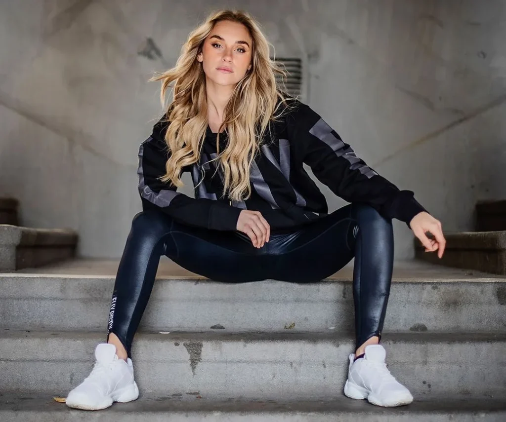 beautiful strong woman posing on stairs for portrait photography, using the stairs as leading lines