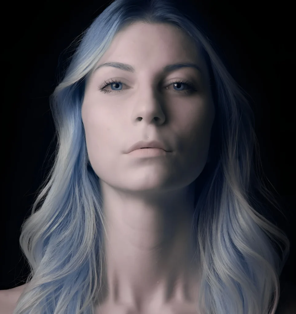 model looking into the camera for an infrared photography portrait, blue infrared hair, dreamy colors, head portrait, beautiful female model