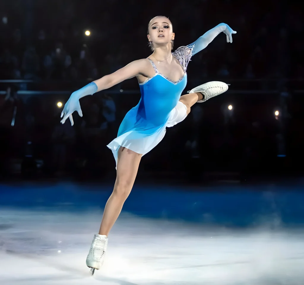 best sports camera shot a photo of kamila valieva figure skating with beautiful blue dress, strong emotions, ice skating